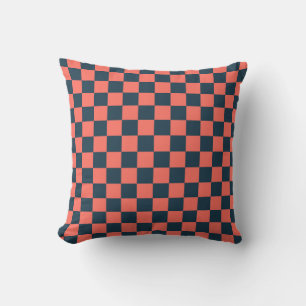 Coral and navy chequerboard pattern cushion