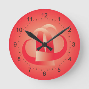 coral hearts hugging round clock