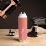 Coral Personalised Wedding Bridesmaid Water Bottle<br><div class="desc">Gift your wedding bridesmaid or maid of honour with this trendy, vacuum Insulated water bottle that features her name in white, stylised script on a coral colour background designed to match your wedding colour scheme . Personalise bottle by editing and replacing name with your own as desired. Select your water...</div>