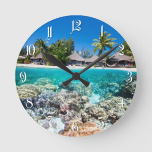 Coral reef and a tropical resort round clock