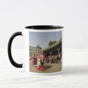 Costumed amateur folk dancers entertain mug