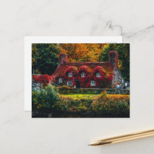 Country Cottage with Red Vines Covering Home Postcard