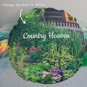 Countryside house with a colorful garden round cushion
