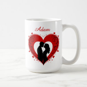 Couple Embracing Inside A Large Red Heart Coffee Mug