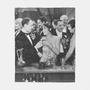 Couple having drink at crowded bar fleece blanket