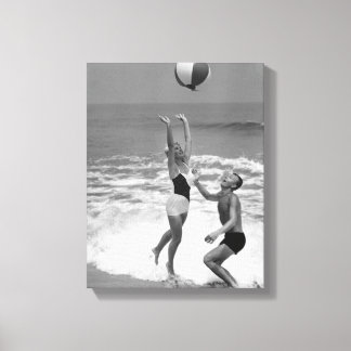 Couple Playing with a Beachball Canvas Print