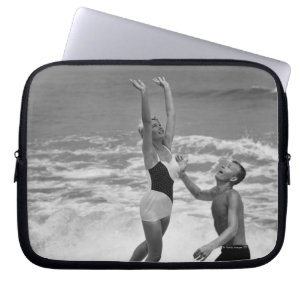 Couple Playing with a Beachball Laptop Sleeve