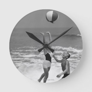 Couple Playing with a Beachball Round Clock