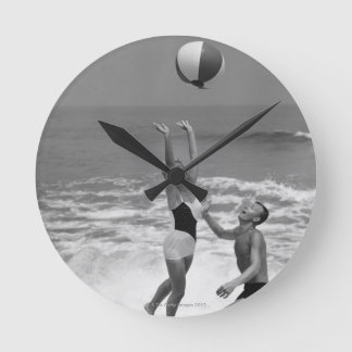 Couple Playing with a Beachball Round Clock
