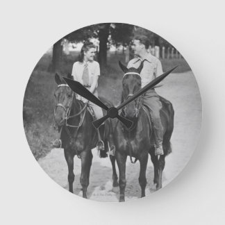 Couple Riding Horses Round Clock