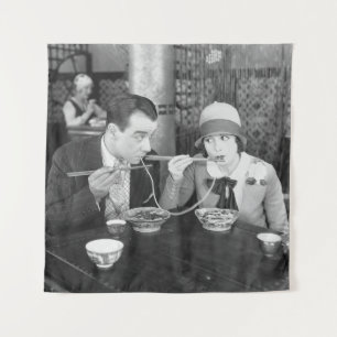 Couple sharing a noodle in a restaurantvintage, fo tapestry