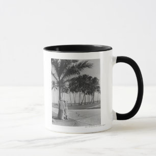 Couple standing at palm tree Rear view B&W Mug
