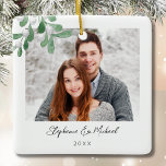 Couples Photo Christmas Ceramic Ornament<br><div class="desc">This Couples Photo Christmas Ornament is decorated with watercolor mistletoe and stylish script typography. Easily customisable with your photo, name, and year. Use the Design Tool to change the text size, style, or colour. Because we create our artwork you won't find this exact image from other designers. Original Watercolor ©...</div>