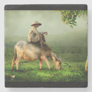 Cow Grazing with Farmer in a Scenic Pasture Stone Coaster