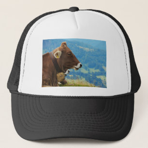 Cow in the mountains trucker hat