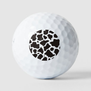Cow pattern background golf balls
