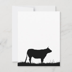 Cow standing resolutely on a dike, with copy space