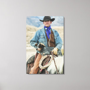 Cowboy and dog on horse canvas print