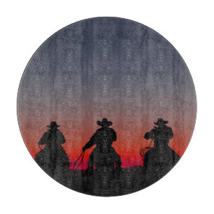 cowboy at sunset cutting board