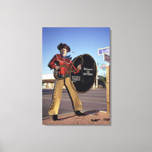 Cowboy figure sign welcoming tourists to Scottsdal