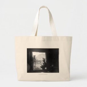 Cowboy in a doorway with horses large tote bag