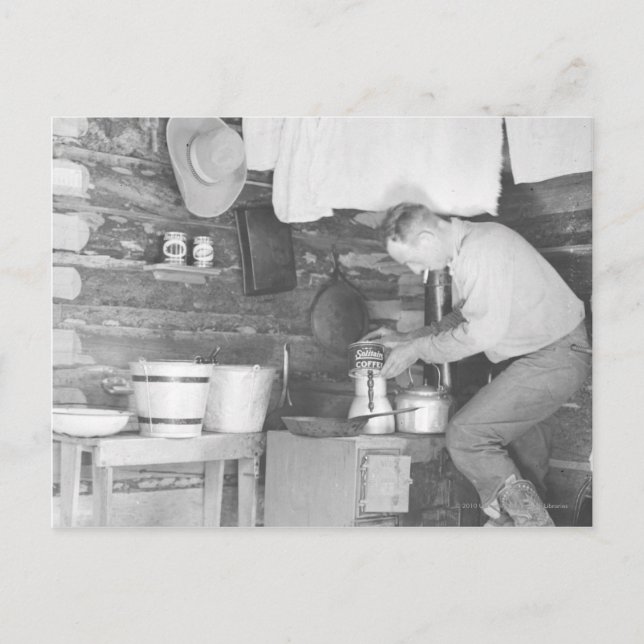 Cowboy making coffee inside the bunkhouse postcard (Front)