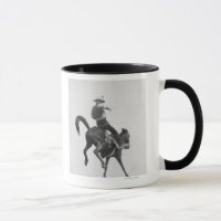 Cowboy Ned Coy Riding Bronco