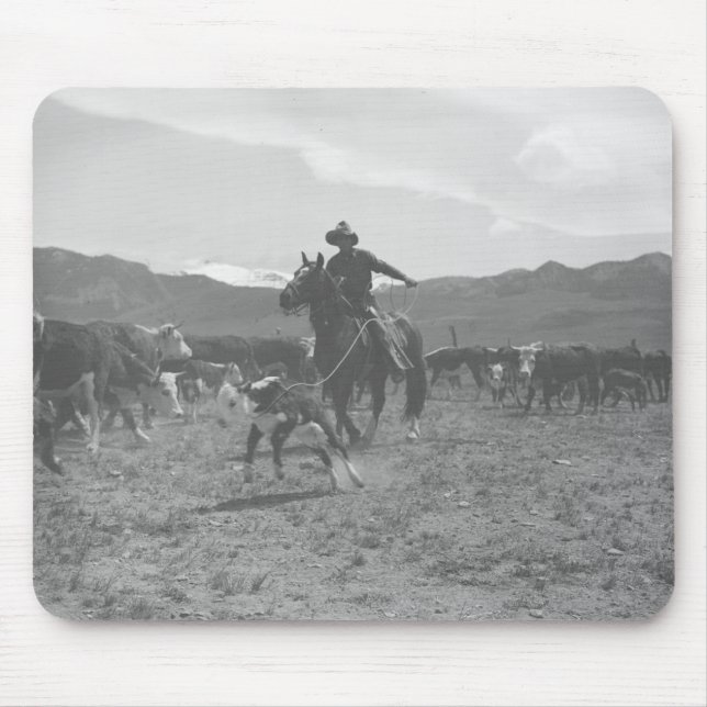 Cowboy roping a calf for spring branding. mouse mat (Front)