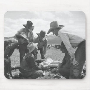 Cowboys looking a magazine mouse mat