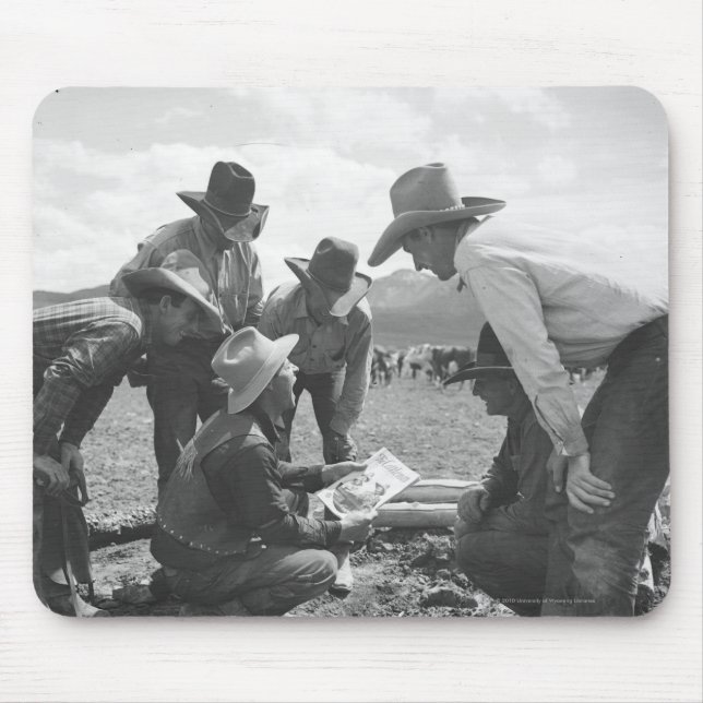 Cowboys looking a magazine mouse mat (Front)