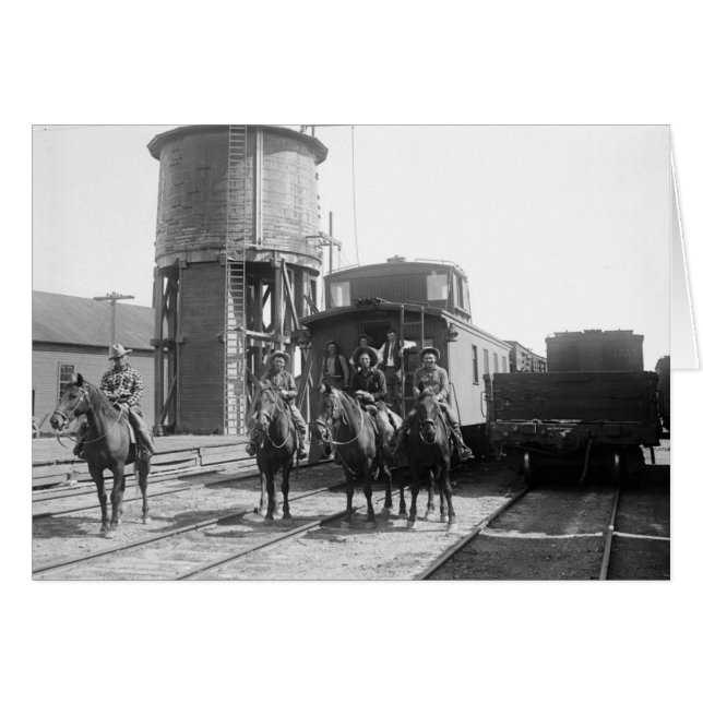 Cowboys on horses posing in front of a train (Front Horizontal)