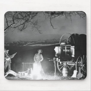 Cowboys playing and singing around a campfire mouse mat