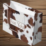 Cowhide Brown White Large Gift Bag<br><div class="desc">As your child's first birthday approaches, I wanted to share a delightful idea that captures the spirit of this special milestone. Imagine a beautiful cow print bag, featuring a charming brown and white design, perfect for kids celebrating their big day. This rustic cowboy-themed gift bag not only adds a fun...</div>
