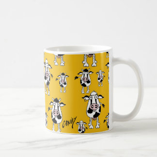 Cows and bulls pattern on yellow background. coffee mug