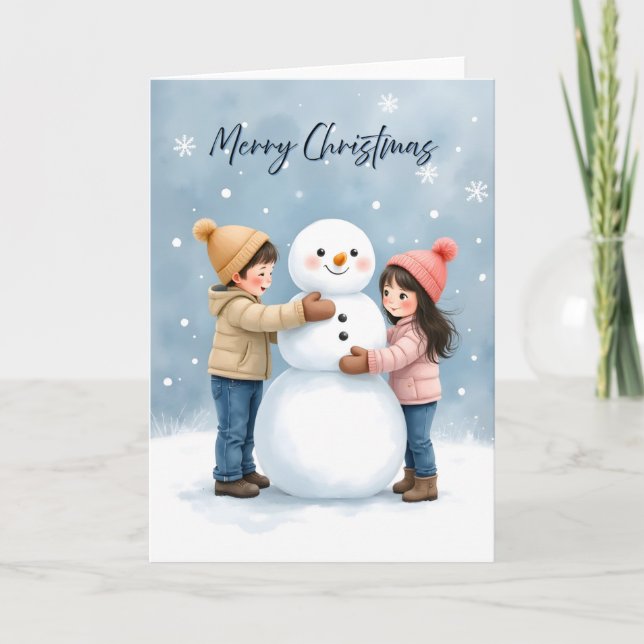 Cozy Kids Building a Snowman Blank Christmas Card (Front)