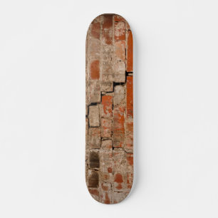 Cracked brick wall skateboard