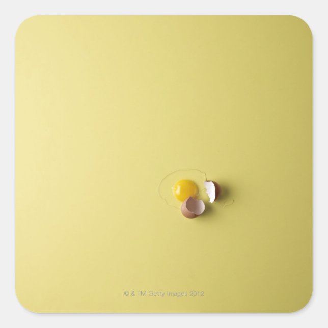 cracked egg on yellow background square sticker (Front)