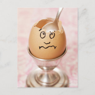 Cracked egg with face drawn on it postcard