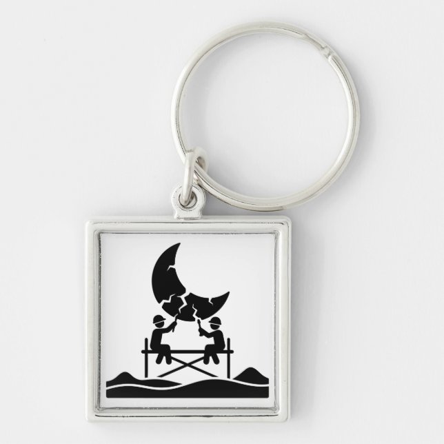 Cracked moon repair workers on scaffold fixing sky key ring (Front)