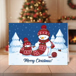 Crafty Snowman Knitting Scarf Holiday Card<br><div class="desc">Vector illustration of two adorable cartoon snowmen dressed in knitted hats and scarves. The big crafty snowman is knitting an oversized scarf for the little one. The scarf is already wrapped several times around the cute little snowman.</div>