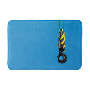 Crane hook with yellow and black stripes hanging bath mat