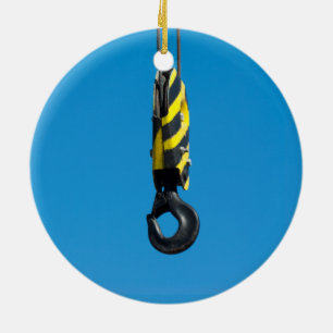 Crane hook with yellow and black stripes hanging ceramic tree decoration