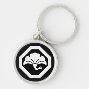 Crane-shaped ginkgo leaf on tray key ring
