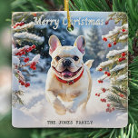 Cream French Bulldog in Snow Merry Christmas Ceramic Ornament<br><div class="desc">Add canine charm to your Christmas decor with this French bulldog picture ornament. The cream-coated dog is pictured running happily through a snowy landscape, with evergreen trees and red berries, on a sunny winter day. The greeting 'Merry Christmas' is at the top in elegant script typography, while the text below...</div>