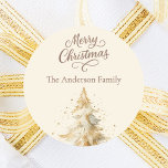 Cream mocha tree Christmas Classic Round Sticker<br><div class="desc">A cream coloured background.  Decorated with a snowcoverd tree.  Merry Christmas is written with an elegant hand-lettered style script.  Personalise and add your family name. Mocha,  muted brown coloured text.</div>