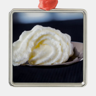 cream on a spoon macro concept metal tree decoration