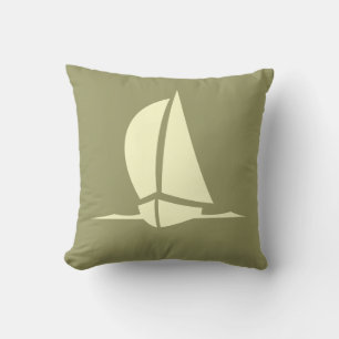 cream sailboat  on  kaki  pillow