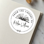 Create your own 'From the Library of' Bookplate Classic Round Sticker<br><div class="desc">Elevate your book collection with our chic bookplate, perfect for book lovers, teachers, and librarians. This elegant bookplate features a hand-drawn open book illustration surrounded by a circular border with a botanical leaf motif, creating a timeless design. The circular frame includes "From the library of" in curved text at the...</div>