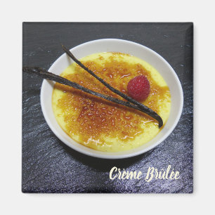 Creme brulee on slate with raspberry and vanilla l magnet