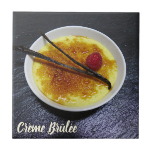 Creme brulee on slate with raspberry and vanilla l tile